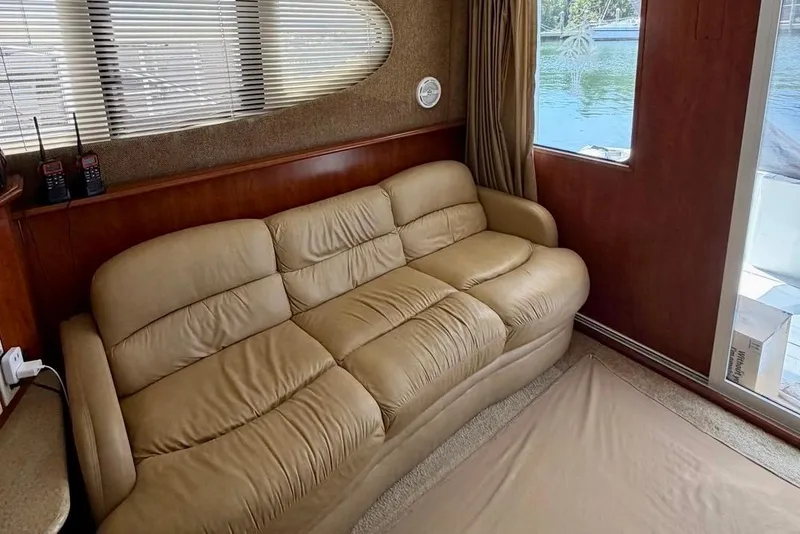 Slide: The Image of Luxurious interior of 2007 Silverton 36 Convertible yacht with beige leather sofa. - 7