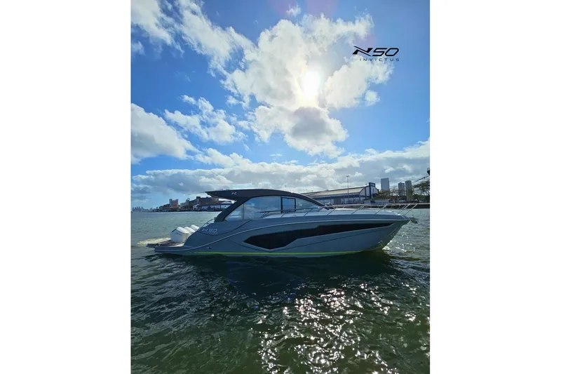 The Image of 2025 NX Boats NX50 Invictus HT yacht on water under blue sky. - 0