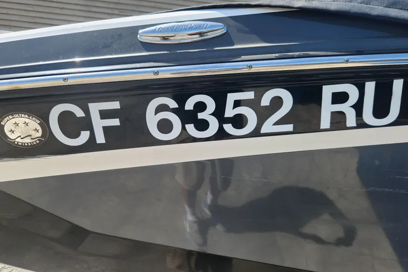 Slide: The Image of 2015 MasterCraft X23 boat with registration CF 6352 RU and super ultra-low emission badge. - 4