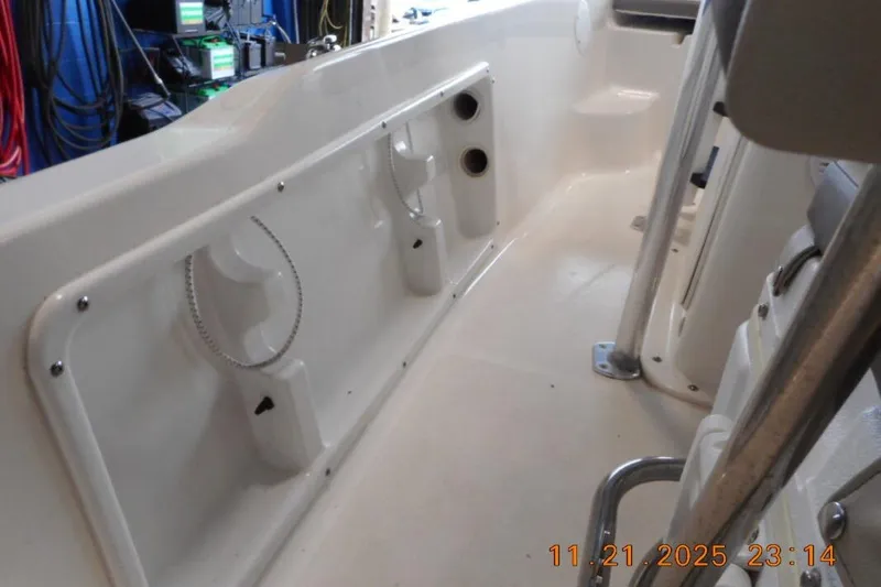 Slide: The Image of Interior view of a 2022 Key West 1720 Center Console boat, showcasing seating and storage. - 10
