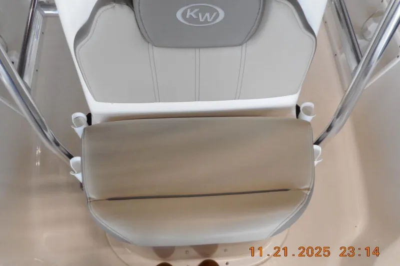 Slide: The Image of 2022 Key West 1720 Center Console boat seat with KW logo, viewed from above. - 13