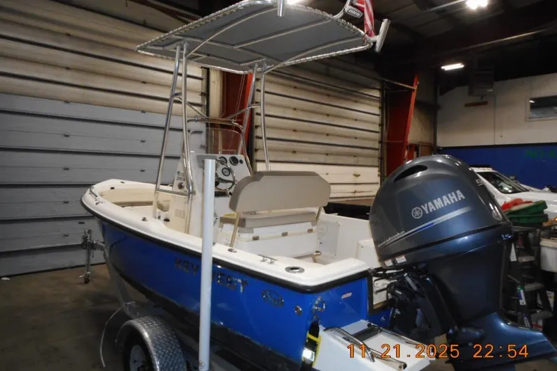 Slide: The Image of 2022 Key West 1720 Center Console boat with Yamaha engine in a garage. - 3