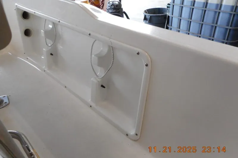 Slide: The Image of 2022 Key West 1720 Center Console boat interior detail with storage compartments. - 9