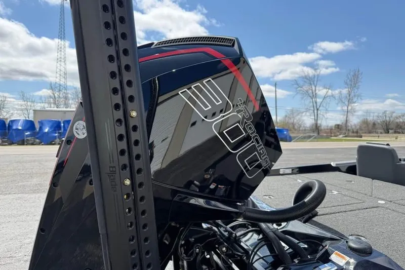 Slide: The Image of 2026 Bass Cat Jaguar STS with powerful 300 Racing engine, outdoors under blue sky. - 3