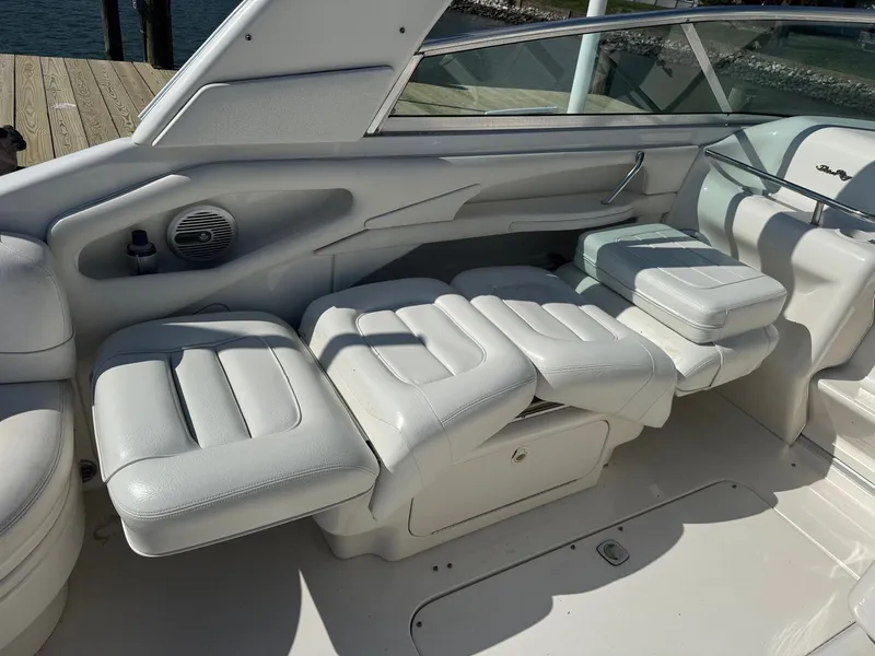 Slide: The Image of Interior of 2021 Sea Ray 280 Sun Sport with white leather seating. - 11
