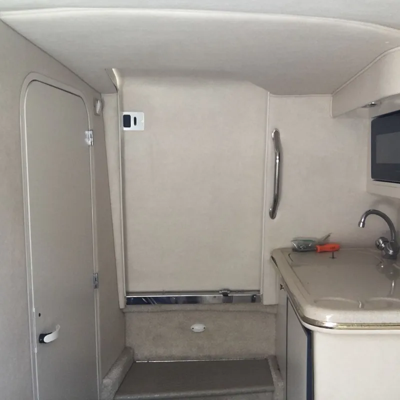 Slide: The Image of Interior of 2021 Sea Ray 280 Sun Sport with sink and storage. - 20