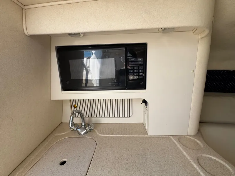 Slide: The Image of Interior of 2021 Sea Ray 280 Sun Sport with microwave and sink. - 21