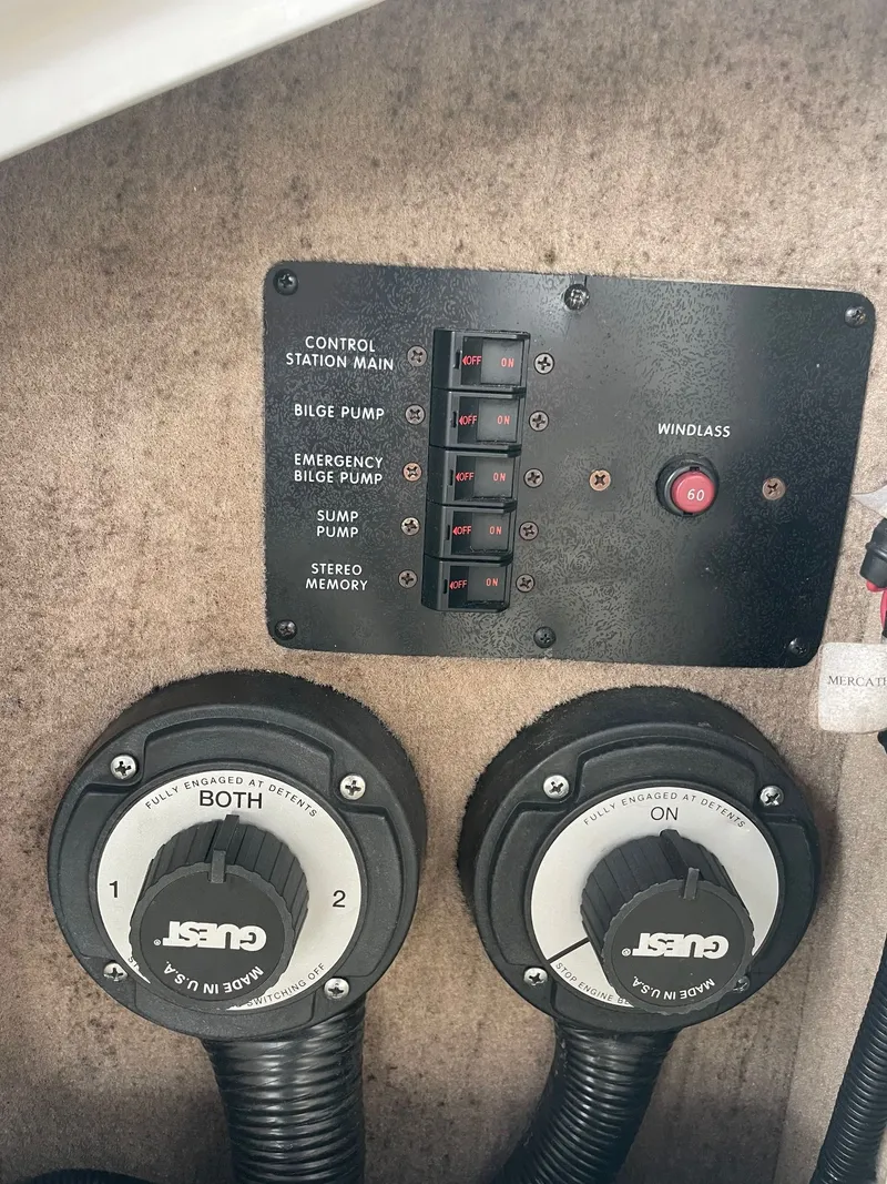 Slide: The Image of Control panel of 2021 Sea Ray 280 Sun Sport with switches and dials. - 23