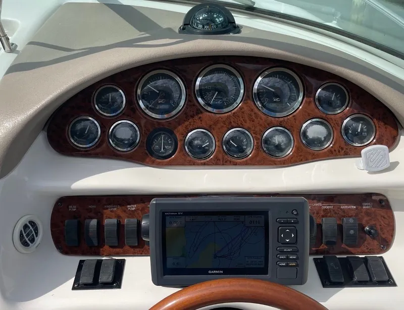 Slide: The Image of Dashboard of 2021 Sea Ray 280 Sun Sport with Garmin navigation system. - 38
