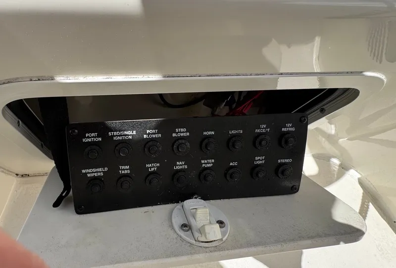 Slide: The Image of Control panel of 2021 Sea Ray 280 Sun Sport with various switches. - 40