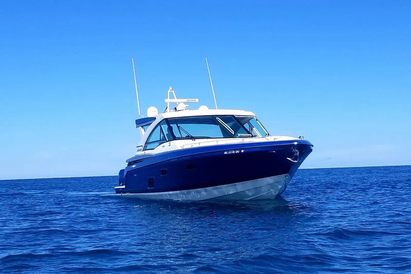 The Image of 2019 Formula 430 Super Sport Crossover yacht cruising on open blue sea. - 1