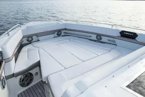 Slide: The Image of 2019 Formula 430 Super Sport Crossover boat with spacious seating on calm water. - 10