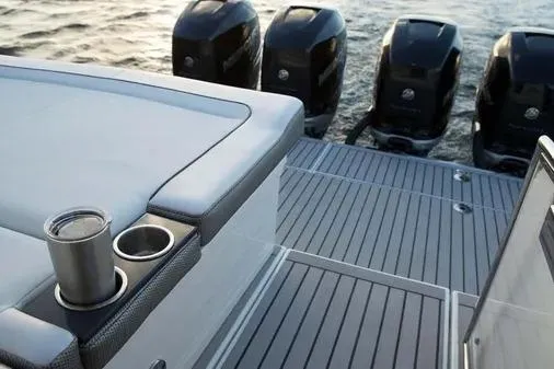 Slide: The Image of 2019 Formula 430 Super Sport Crossover boat with multiple outboard engines and sleek deck design. - 18