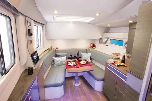 Slide: The Image of 2019 Formula 430 Super Sport Crossover interior with dining area and modern amenities. - 19