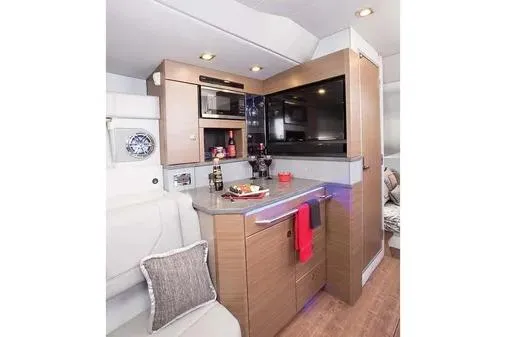 Slide: The Image of 2019 Formula 430 Super Sport Crossover interior with modern kitchen amenities. - 22
