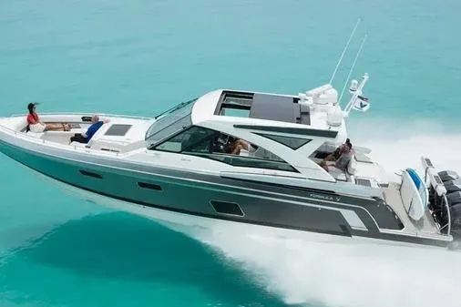 Slide: The Image of 2019 Formula 430 Super Sport Crossover cruising on turquoise waters. - 4