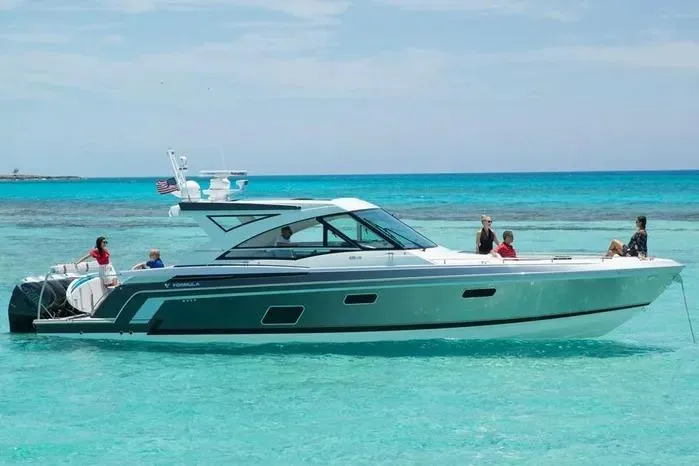 Slide: The Image of 2019 Formula 430 Super Sport Crossover yacht cruising in clear turquoise waters. - 7