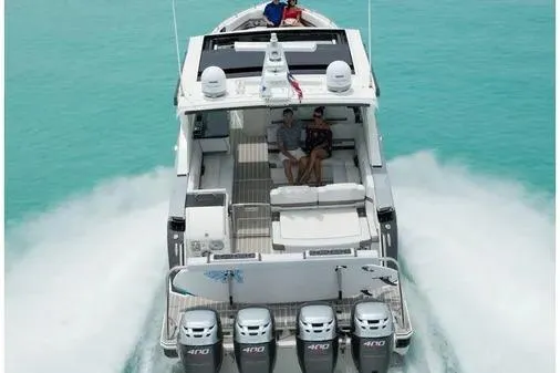 Slide: The Image of 2019 Formula 430 Super Sport Crossover cruising on turquoise waters, rear view. - 8