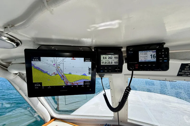 Slide: The Image of Boat cockpit with navigation and communication equipment on a 1980 Roughwater 41. - 11