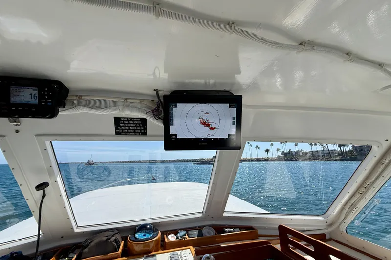 Slide: The Image of Interior view of 1980 Roughwater 41 boat with navigation equipment and ocean scenery. - 12