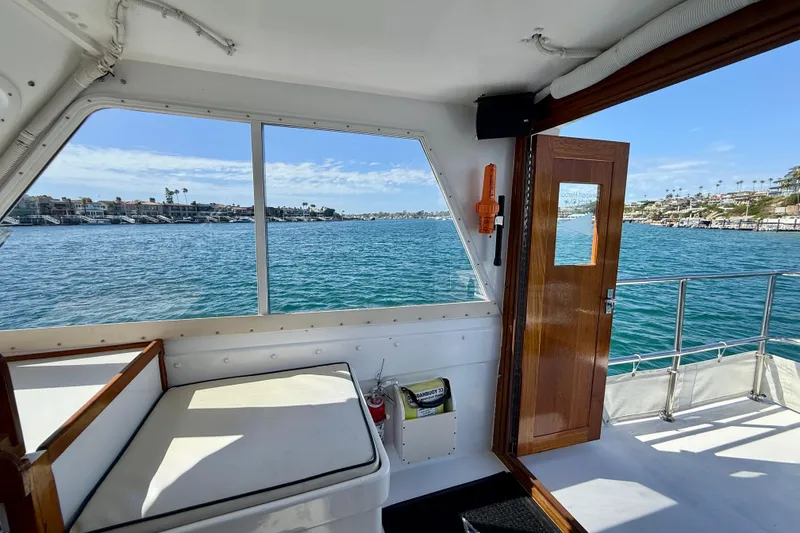 Slide: The Image of Interior view of 1980 Roughwater 41 yacht overlooking scenic waterfront. - 15