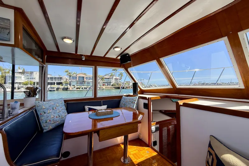 Slide: The Image of Interior of 1980 Roughwater 41 boat with waterfront view through large windows. - 29
