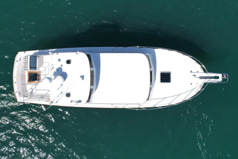 Slide: The Image of Aerial view of 1980 Roughwater 41 boat on clear blue water. - 3