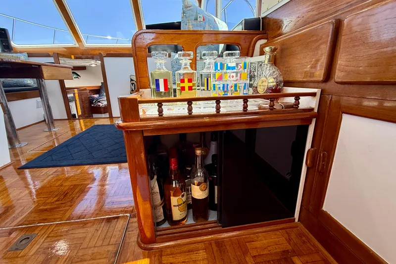 Slide: The Image of Interior of 1980 Roughwater 41 yacht with wooden bar and liquor bottles. - 35