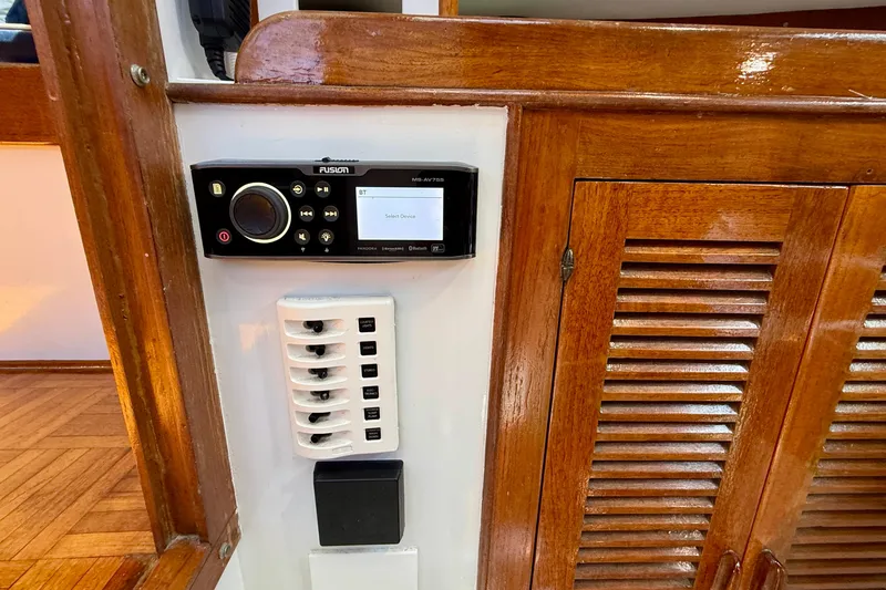 Slide: The Image of 1980 Roughwater 41 interior with Fusion stereo system and wooden cabinetry. - 38