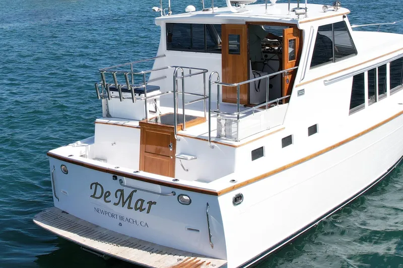 Slide: The Image of 1980 Roughwater 41 yacht named "DeMar" in Newport Beach, CA, on the water. - 4