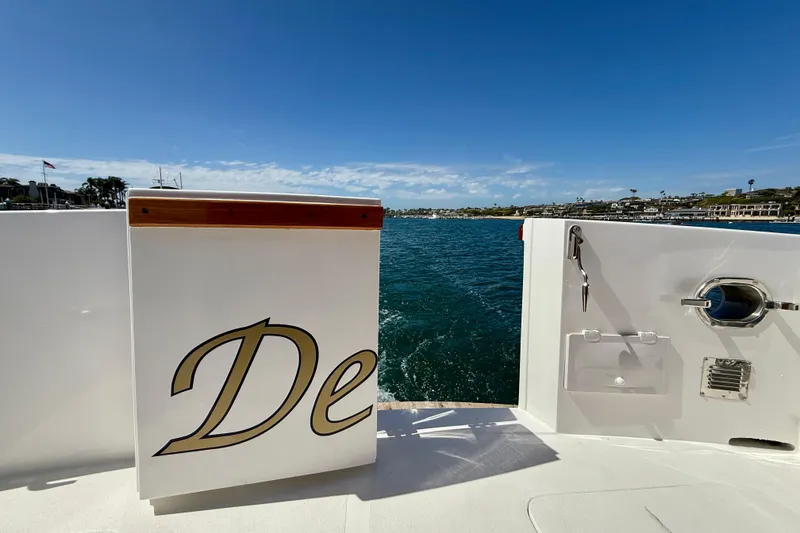 Slide: The Image of 1980 Roughwater 41 yacht deck with ocean view under clear blue sky. - 55