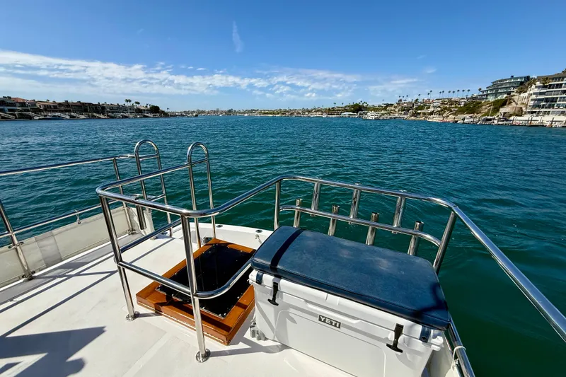 Slide: The Image of 1980 Roughwater 41 boat deck overlooking scenic waterfront and coastal homes. - 59