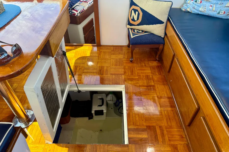 Slide: The Image of Interior of 1980 Roughwater 41 boat with open hatch and wooden flooring. - 60
