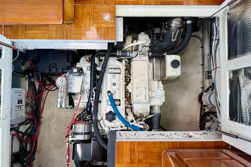 Slide: The Image of Engine compartment of a 1980 Roughwater 41 boat, showcasing detailed mechanical components. - 61