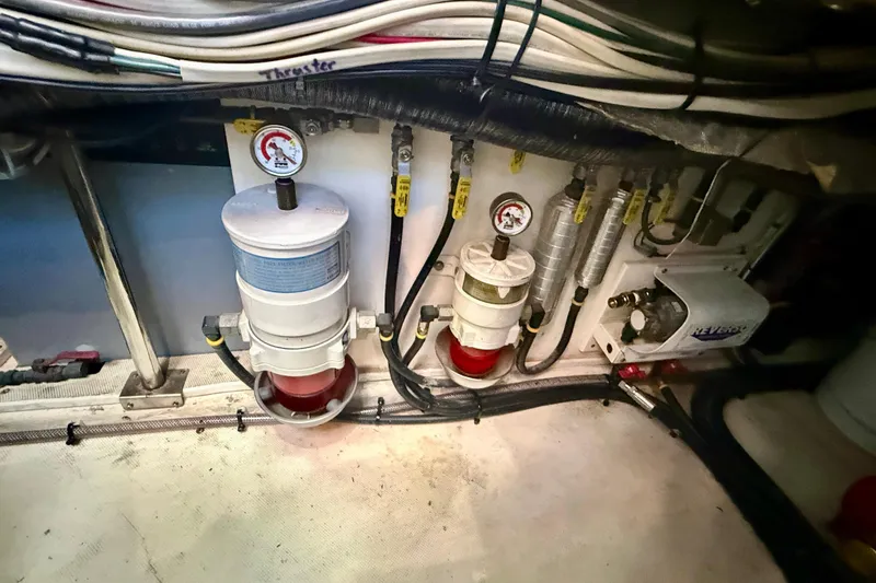 Slide: The Image of Engine room of 1980 Roughwater 41 boat with fuel filters and gauges. - 62