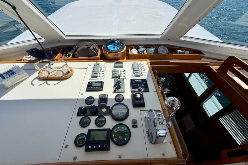 Slide: The Image of Cockpit of 1980 Roughwater 41 boat with navigational instruments and controls. - 9