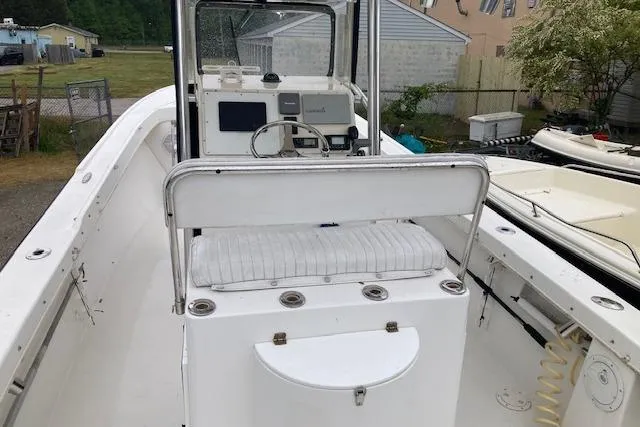 Slide: The Image of 2009 Judge 27 Center Console boat with white seating and control panel. - 12