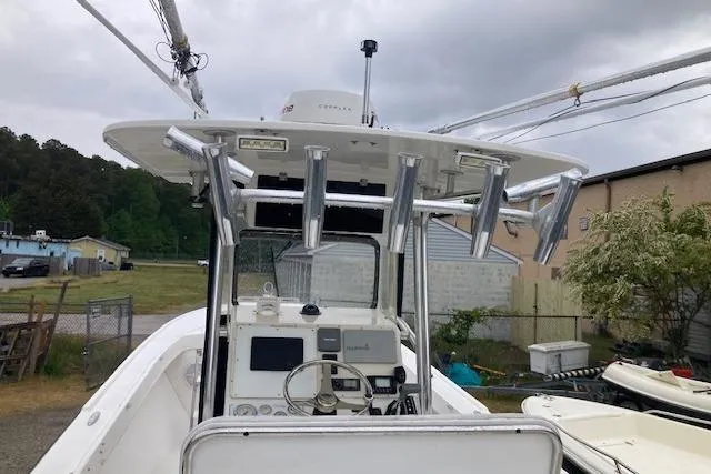 Slide: The Image of 2009 Judge 27 Center Console boat with fishing rod holders and navigation equipment. - 13