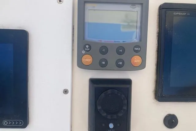 Slide: The Image of Control panel of a 2009 Judge 27 Center Console boat with navigation displays. - 4
