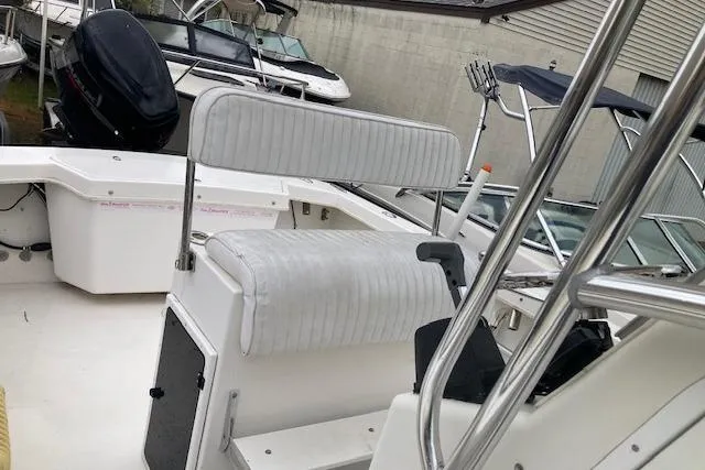 Slide: The Image of 2009 Judge 27 Center Console boat interior with seating and control panel. - 5