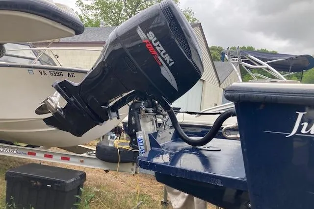 Slide: The Image of 2009 Judge 27 Center Console boat with Suzuki outboard motor on trailer. - 6