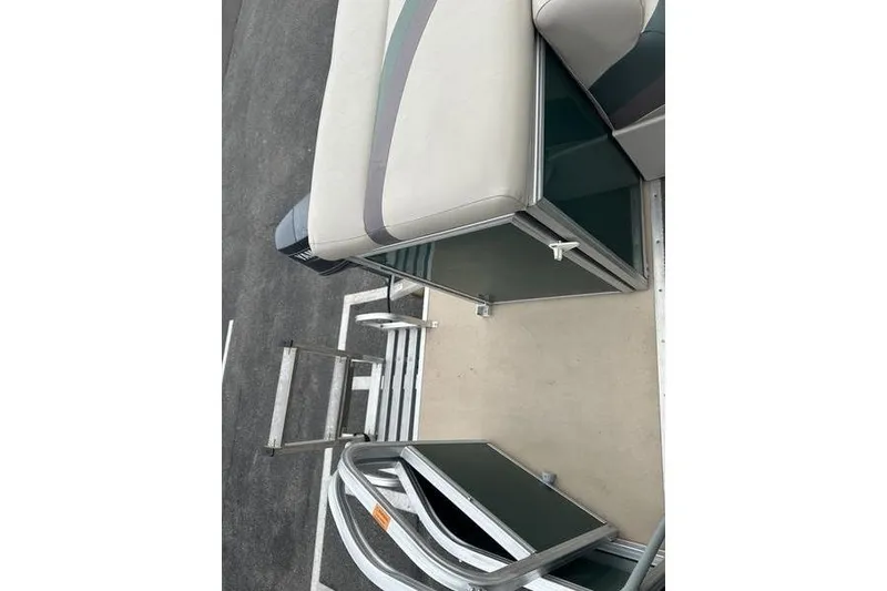 Slide: The Image of 2011 South Bay 420 CR boat interior with seating and ladder. - 17