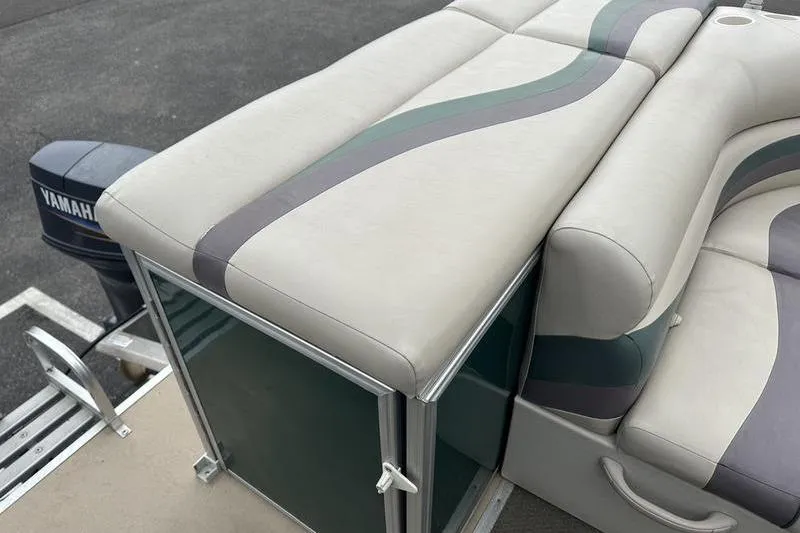 Slide: The Image of 2011 South Bay 420 CR boat with cushioned seating and Yamaha motor. - 19