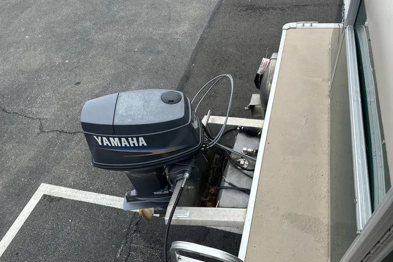 Slide: The Image of 2011 South Bay 420 CR with Yamaha outboard motor on a paved surface. - 20