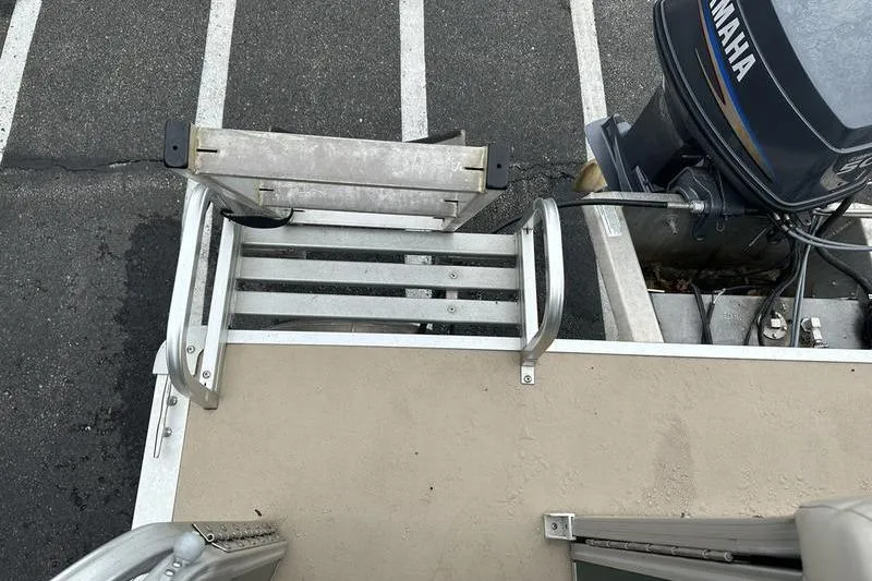 Slide: The Image of Rear view of 2011 South Bay 420 CR boat with Yamaha outboard motor and swim ladder. - 23