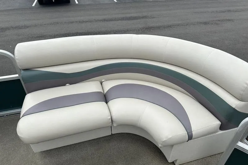Slide: The Image of 2011 South Bay 420 CR boat seating with curved design and gray accents. - 4