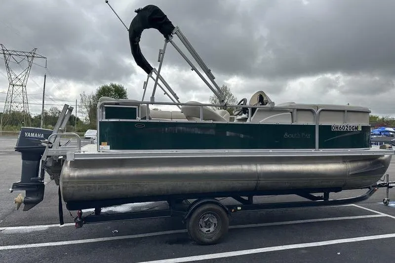 Slide: The Image of 2011 South Bay 420 CR pontoon boat on trailer, featuring Yamaha outboard motor. - 5
