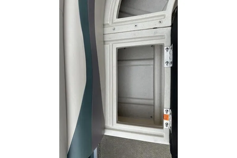 Slide: The Image of Open storage compartment on a 2011 South Bay 420 CR boat. - 9