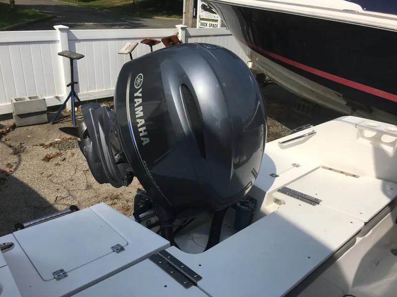 Slide: The Image of Yamaha outboard motor on a 2016 Release 208 RX boat. - 11