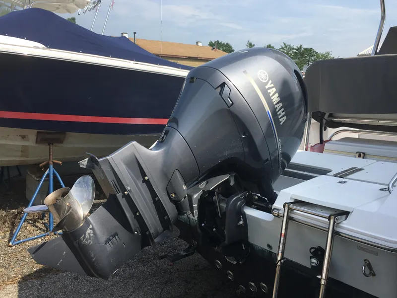Slide: The Image of Yamaha outboard motor on a 2016 Release 208 RX boat. - 13